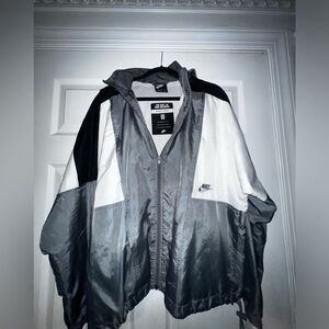 Nike rain jacket’s / consealble hood / wind breaker / adjustable belt